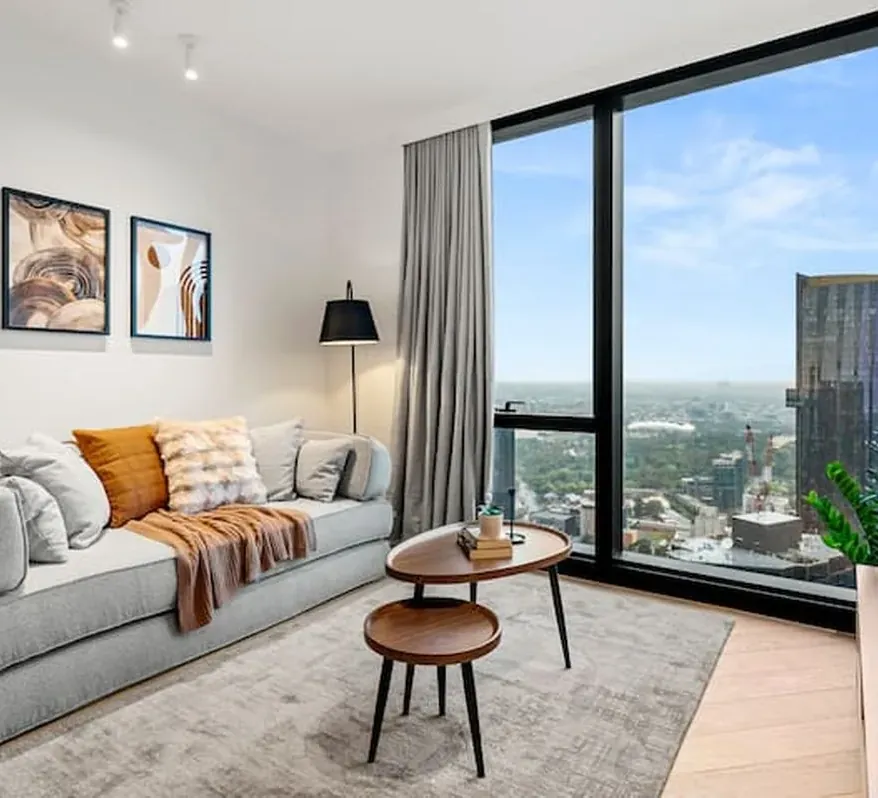 Living room of a high-rise short-stay apartment with city views