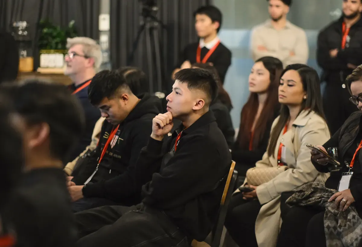 Members listening in the front rows during a talk