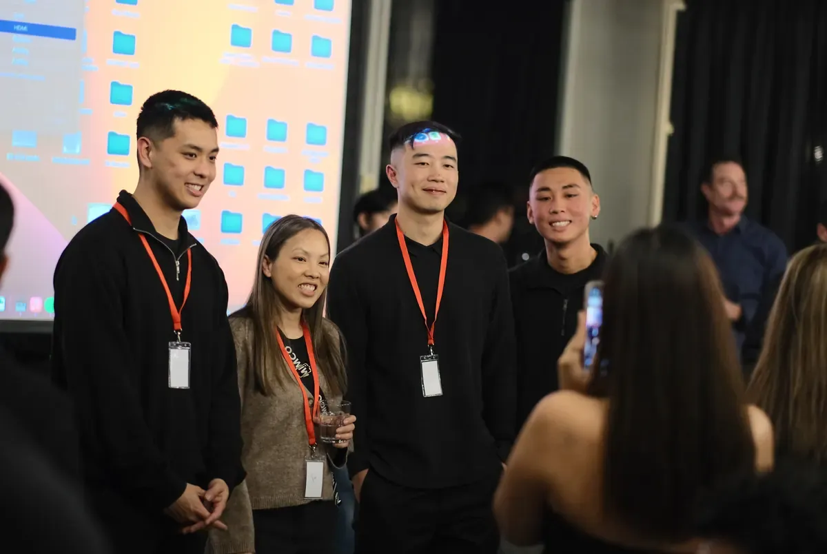Stanley Ma, Terence Mok and Jordan Pham with a member at the first live event