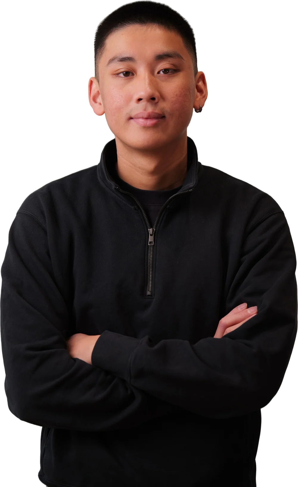 Jordan Pham, arms crossed, in a black quarter-zip